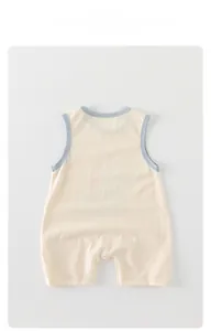 Detail of baby sleeveless cotton romper featuring snaps for easy diaper changes
