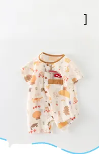 Close-up of baby romper showing mushroom embroidery and cute animal cartoon prints