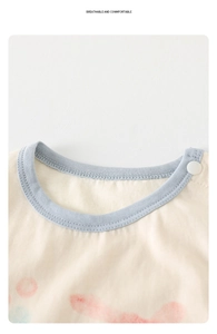 Detail of baby cotton romper neck with snap button and breathable fabric texture