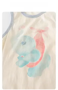 Close-up of baby romper showing breathable cotton fabric and blue elephant cartoon embroidery