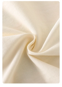 Macro shot of soft off-white cotton knit fabric texture for newborn summer romper