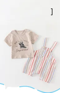 Detail of baby summer cotton T-shirt with bear print and striped bib shorts set