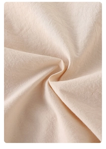 Macro shot of breathable beige cotton fabric texture for baby summer rompers
