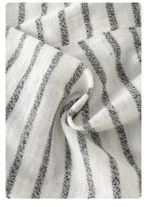 Detailed close-up showing the fine knit texture and black stripes on white cotton fabric