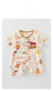 Detail of baby cotton romper with cartoon prints, wooden buttons, and 3D plush mushrooms