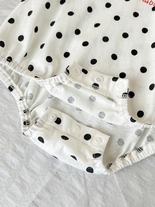Short sleeve baby bodysuit in white with black polka dots and red Rabbit embroidery