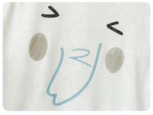 Close-up of cute cartoon facial print on a white soft cotton baby short sleeve bodysuit