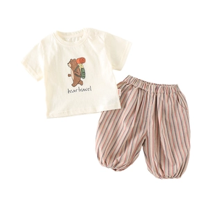 Cute kids summer set with bear graphic t-shirt and colorful striped lantern shorts