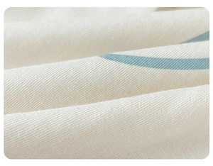 Close-up of soft jersey cotton fabric with delicate light blue striped print for baby onesies