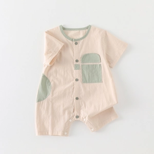 Short sleeve baby romper in cotton with green patchwork and button closure