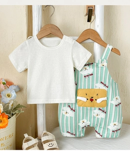 Close-up of baby cotton set with striped overalls, cartoon puppy print and snap button crotch
