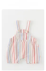 Close-up of baby striped romper with yellow buttons and breathable cotton fabric texture