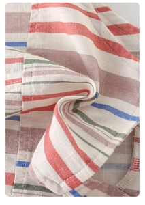 Close-up of multicolored striped cotton linen fabric showing breathable texture and stitching