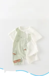 Detail of baby short-sleeve romper with elephant cartoon and snap buttons at crotch