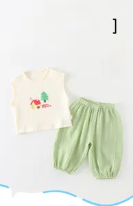 Breathable cotton baby summer outfit with sleeveless top and green bloomers detail