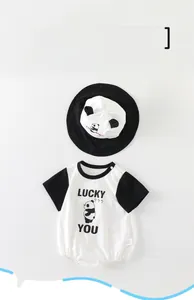 Detail showing baby cotton bodysuit with panda print and matching sun hat with ears