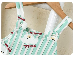Close-up of cotton baby romper with striped pattern and cute cartoon bear print