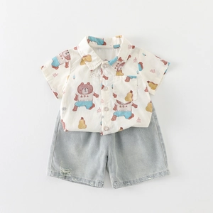 Two-piece baby boy summer outfit with cartoon bear shirt and blue denim shorts