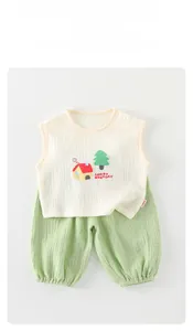 Detail of baby summer set showing breathable cotton gauze fabric and cartoon print