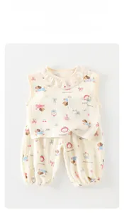 Detail of baby summer set with ruffle collar and cute puppy print on soft cotton gauze
