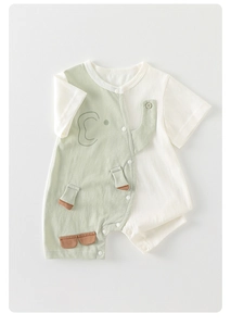 Detail of baby elephant romper with wood button and snap closures for easy diaper changes