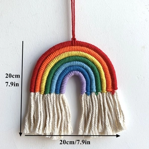 Detail view of woven rainbow wall hanging with 20cm diameter and cotton rope tassels