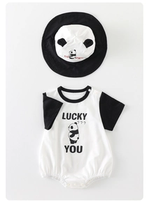 Detail of baby panda romper with matching bucket hat and cute Lucky You print