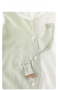 Detail view of baby romper featuring breathable cotton fabric and elephant design elements
