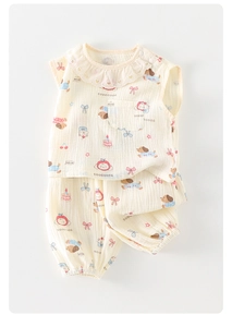 Detail of baby cotton gauze set with scalloped lace collar and cute puppy print