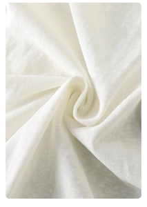 Close-up of soft breathable white cotton fabric texture on baby summer romper