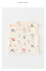 Detail of baby cotton gauze vest featuring heart cutouts and cute puppy patterns