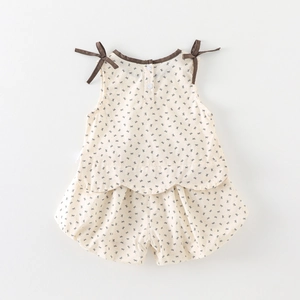 Infant floral two-piece set featuring sleeveless bow top and bloomers in cream and black