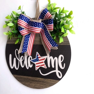 Patriotic wooden Welcome sign with American flag star, greenery and burlap bow for door decor