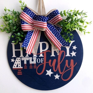 Wooden Independence Day door sign with Happy 4th of July text and festive bow decoration