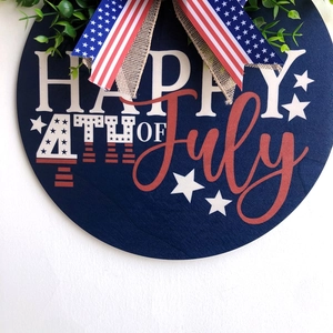 Wooden American Independence Day door wreath with Fourth of July stars and stripes bow