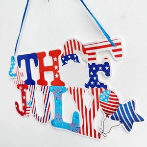 Detail view of 4th July wall decoration featuring USA flag patterns and festive gnome