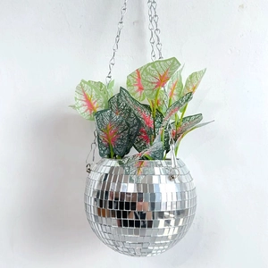 Hanging silver disco ball planter with vibrant green leaves and reflective mirror finish