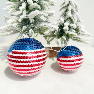 Detail of red white and blue sequined Independence Day hanging ornaments with flag patterns