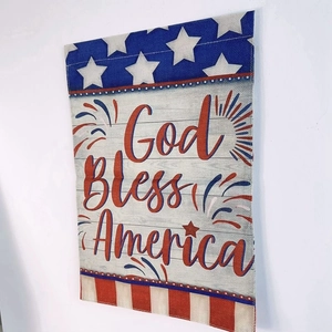 Detail of God Bless America double sided linen garden flag with rustic burlap texture
