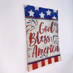 Macro shot of God Bless America burlap garden flag with stars and stripes detail