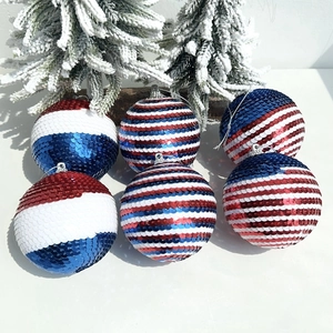 Detail of sequined patriotic ornaments in red, white, and blue with glitter finish