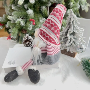Detail of a 60cm Christmas gnome with a knitted snowflake hat and long white beard decoration