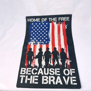 Close-up of linen garden flag featuring American flag design and patriotic soldier silhouettes