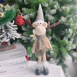 Charming plush Christmas reindeer doll ornament in Nordic style on festive tree background