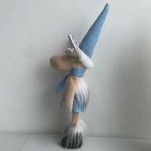 Blue Christmas reindeer plush with silver sequin antlers and a striped winter scarf
