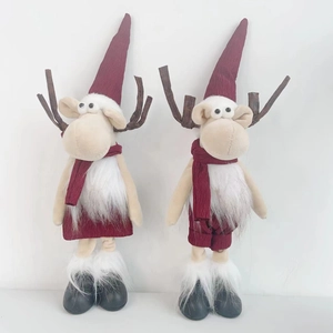 Christmas reindeer plush figurines in red knit outfits and branch antlers for home decor