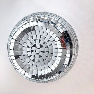 Close-up of a silver mosaic disco ball with reflective glass mirror tiles for parties