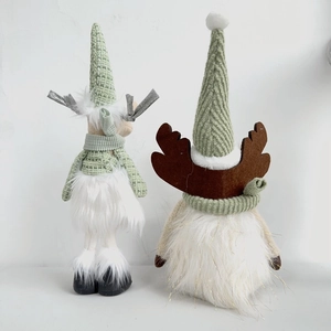 Detail of mint green Christmas reindeer plush dolls in standing and sitting poses