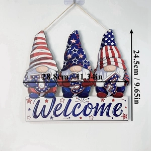 Detail view of Independence Day gnome welcome sign with USA letters and patriotic patterns