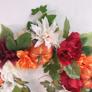 Autumn harvest wreath with white dahlia, red peonies, and mini pumpkins for Halloween